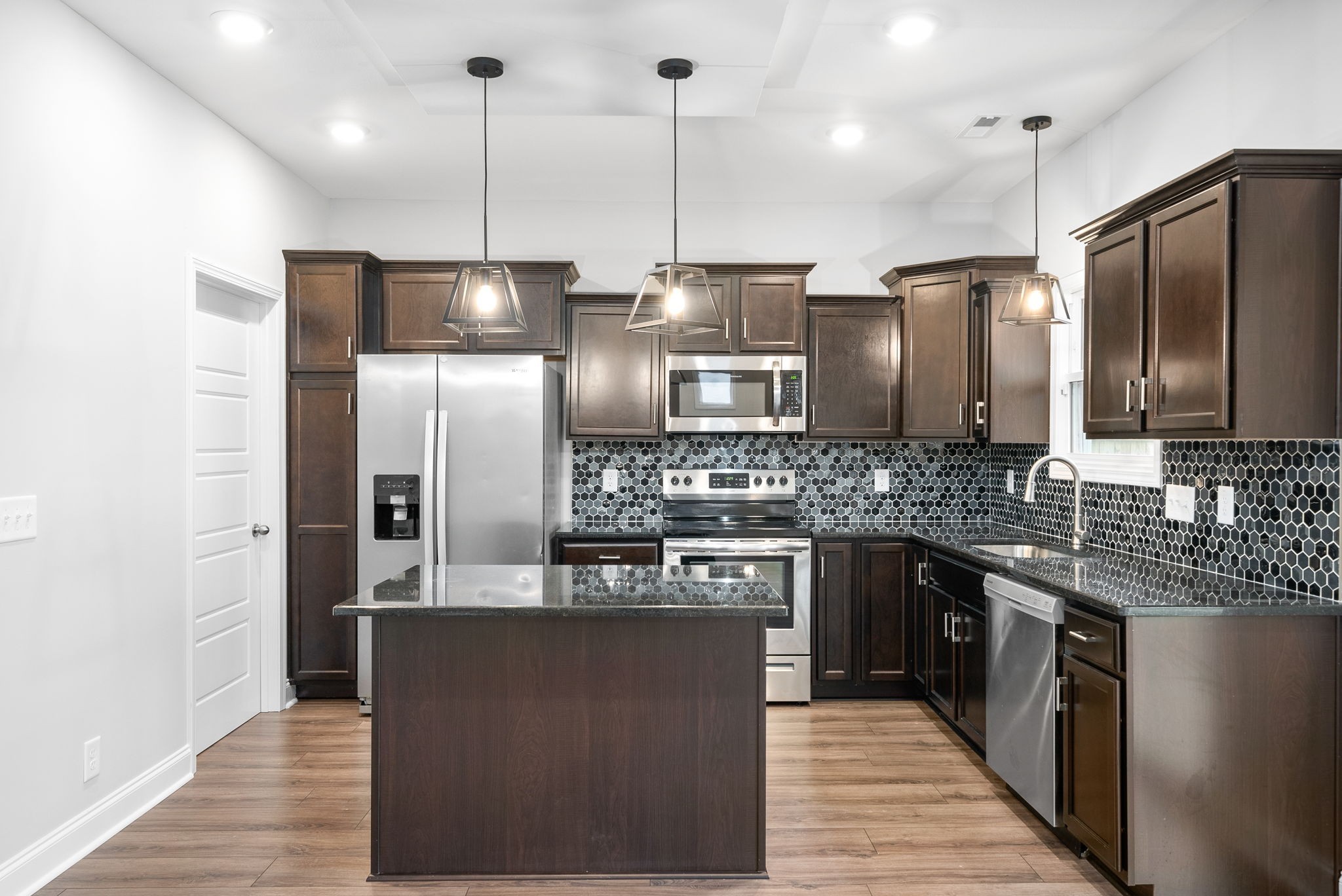202 Copeland Road Clarksville, TN 37042 - Photo 3 of 19 a kitchen with stainless steel appliances granite countertop a refrigerator a sink a stove and oven