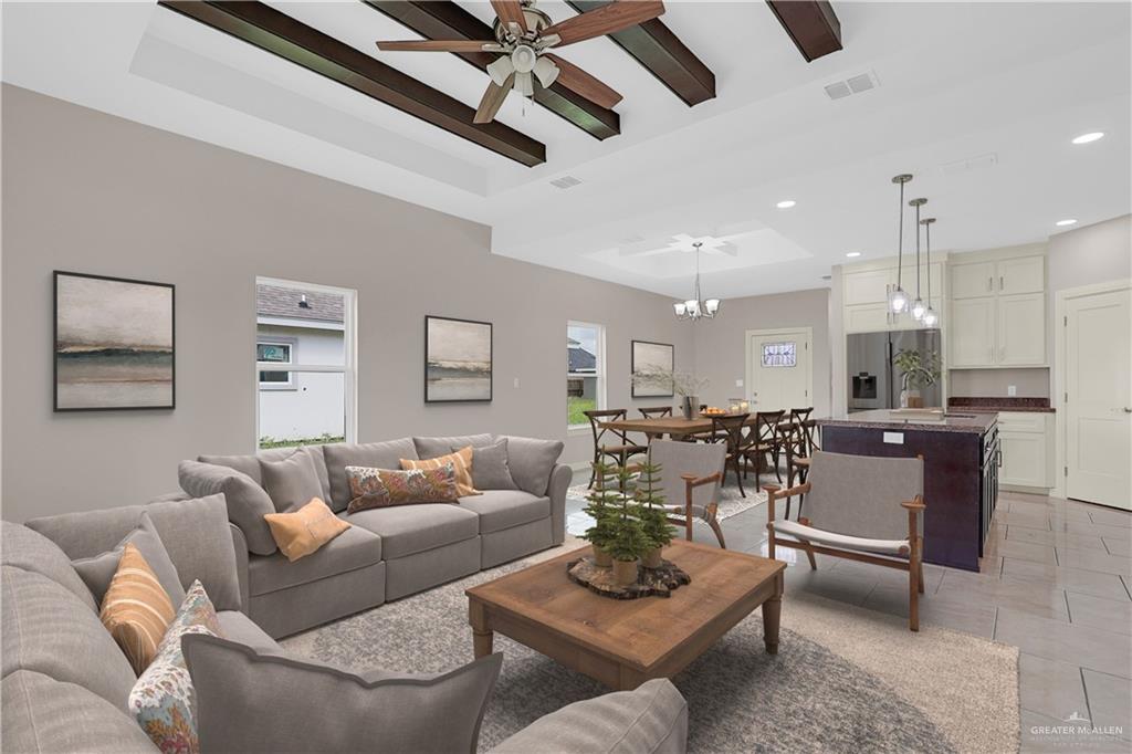 824 Lark Street Alamo, TX 78516 - Photo 3 of 17 Living area with a raised ceiling, beam ceiling, light tile patterned floors, a ceiling fan, and recessed lighting