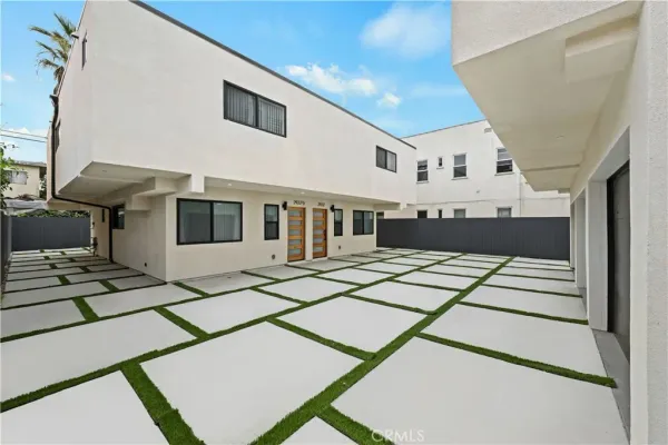 a view of balcony and hall with wooden floor