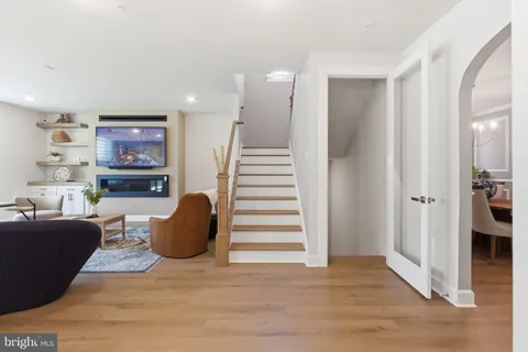 a kitchen with stainless steel appliances kitchen island granite countertop a refrigerator oven and a stove