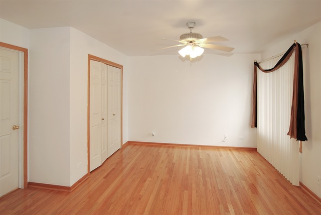 7290 Ogden Avenue, Unit 2 Riverside, IL 60546 - Photo 6 of 10 a view of a room with wooden floor and fan
