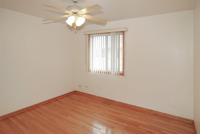7290 Ogden Avenue, Unit 2 Riverside, IL 60546 - Photo 7 of 10 a view of empty room with wooden floor and fan