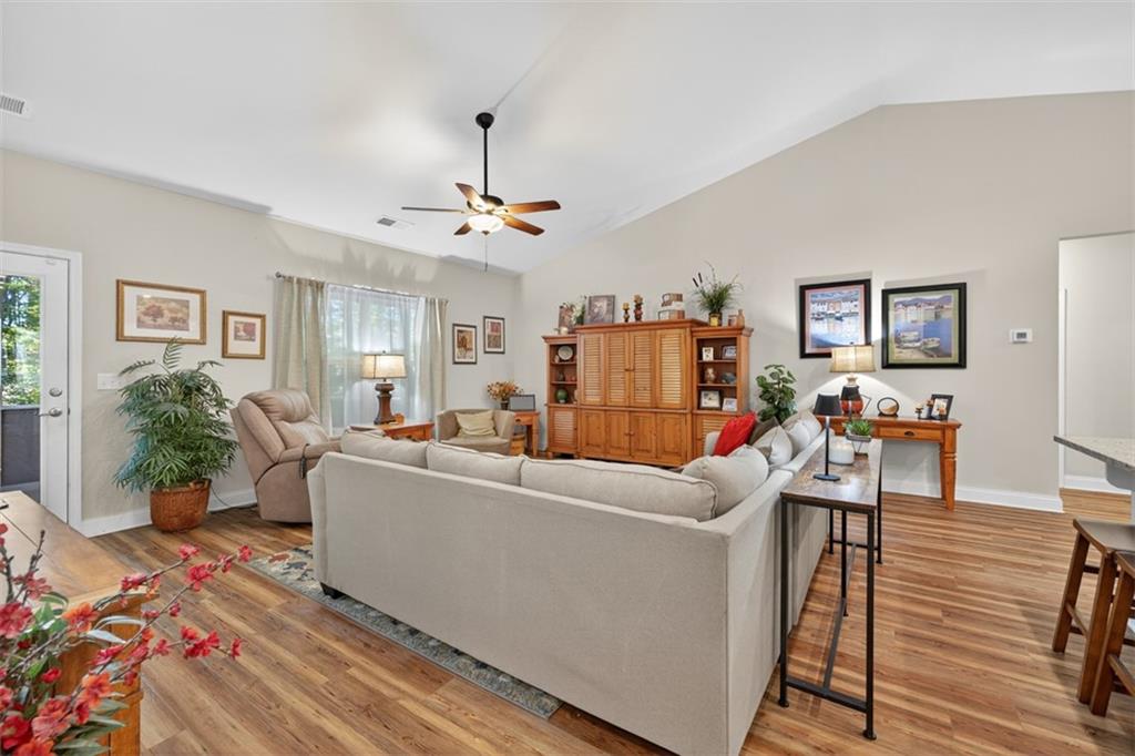 829 River Fall Drive Jefferson, GA 30549 - Photo 20 of 63 a living room with furniture and a flat screen tv