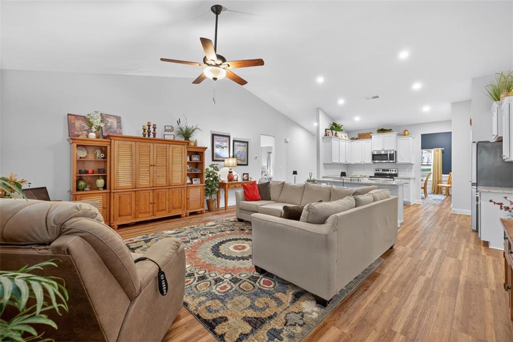 829 River Fall Drive Jefferson, GA 30549 - Photo 21 of 63 a living room with furniture and kitchen view
