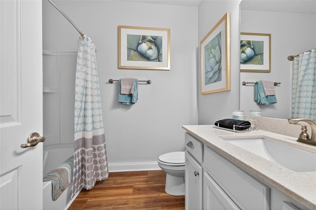 829 River Fall Drive Jefferson, GA 30549 - Photo 29 of 63 a bathroom with a sink a toilet and shower