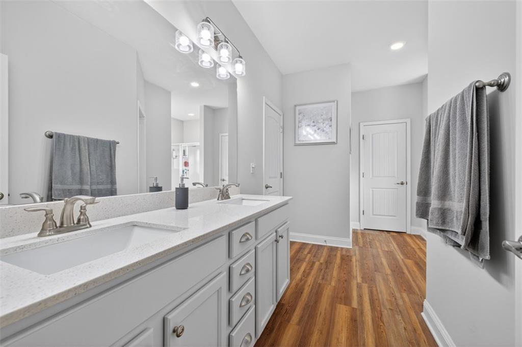 829 River Fall Drive Jefferson, GA 30549 - Photo 30 of 63 a spacious bathroom with a double vanity sink a mirror a vanity and a shower