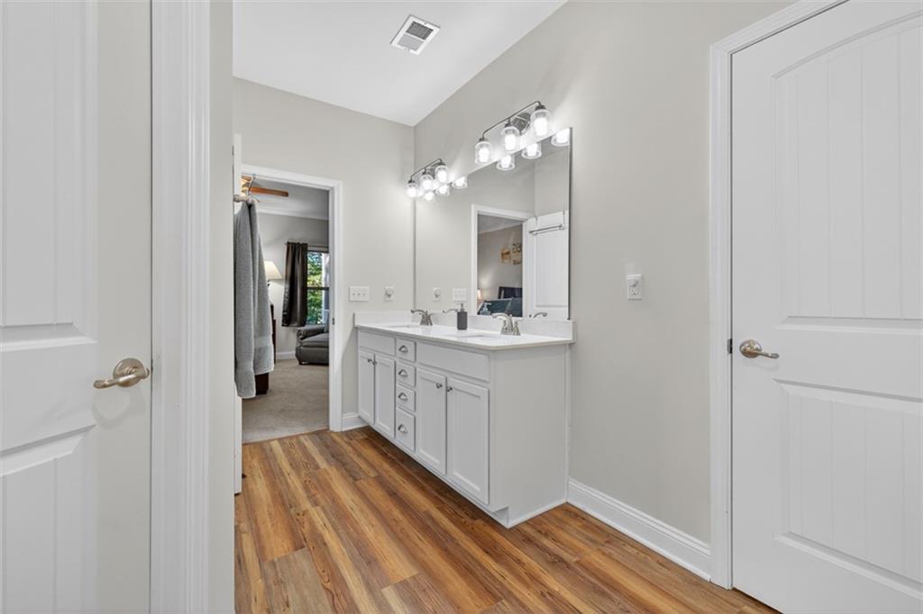 829 River Fall Drive Jefferson, GA 30549 - Photo 32 of 63 a spacious bathroom with a double vanity sink a mirror and a shower