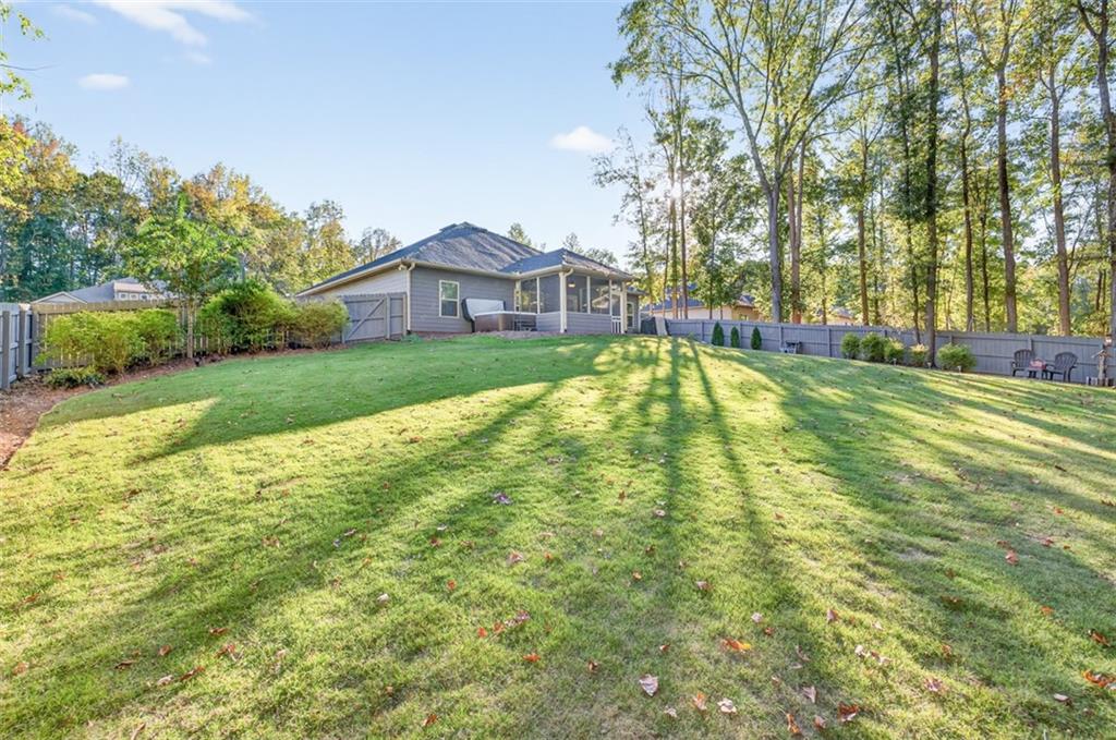 829 River Fall Drive Jefferson, GA 30549 - Photo 44 of 63 a view of a house with a big yard and large trees