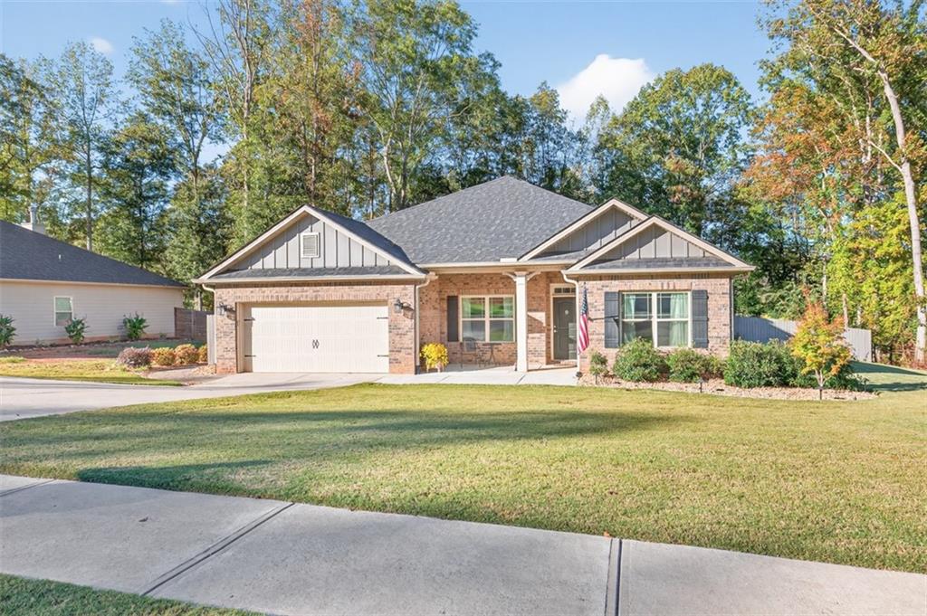 829 River Fall Drive Jefferson, GA 30549 - Photo 63 of 63 a front view of a house with a yard and trees