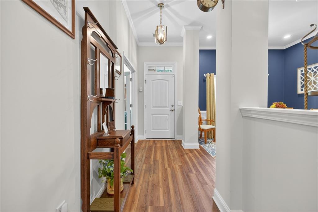 829 River Fall Drive Jefferson, GA 30549 - Photo 7 of 63 a view of a hallway with wooden floor and staircase