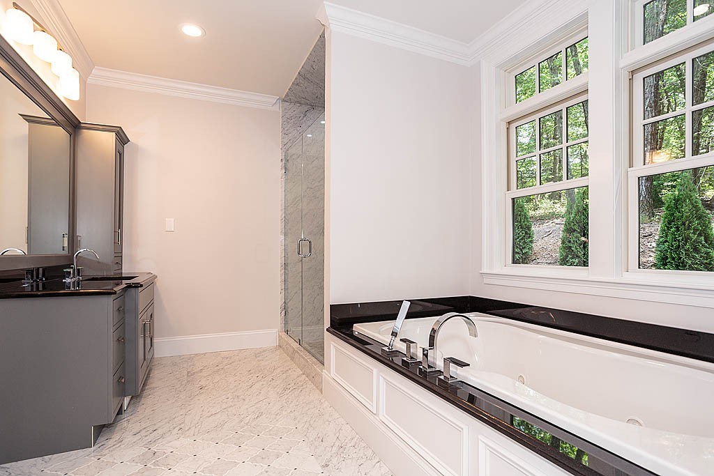 211 Sandy Pond Road Lincoln, MA 01773 - Photo 15 of 22 a view of a bathtub in a bathroom