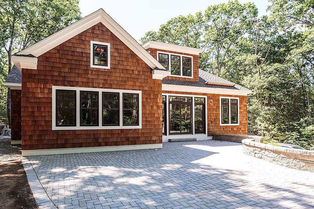 211 Sandy Pond Road Lincoln, MA 01773 - Photo 21 of 22 a front view of a house with a yard