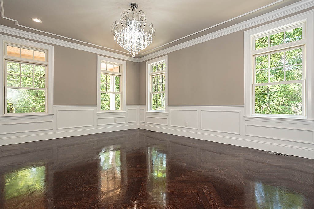 211 Sandy Pond Road Lincoln, MA 01773 - Photo 8 of 22 a view of an empty room with wooden floor and a window