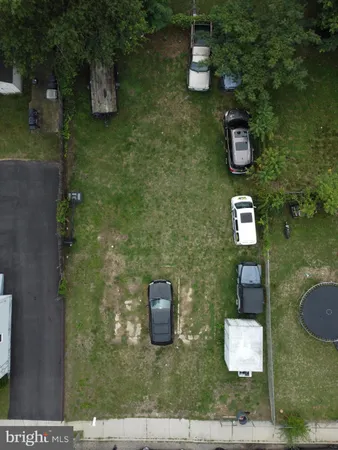 an aerial view of a house with outdoor space
