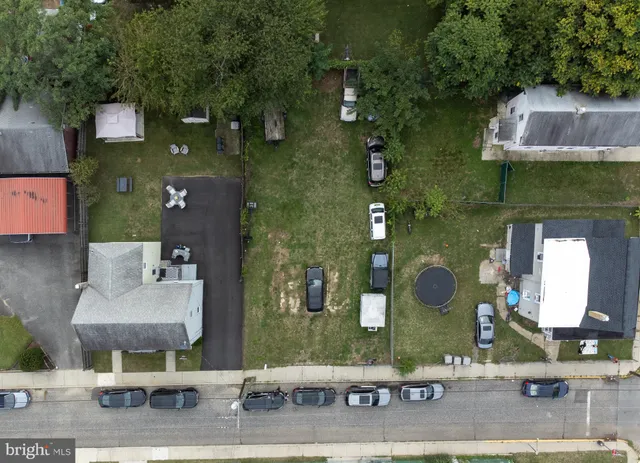 an aerial view of a house with outdoor space