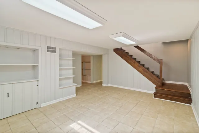 a view of an empty room with stairs