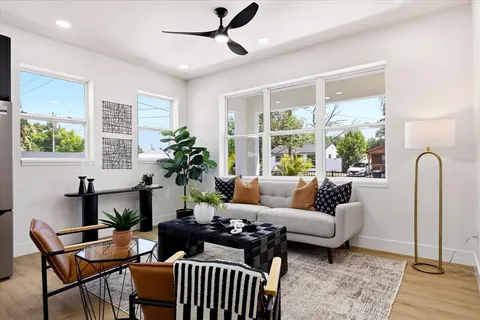 a living room with furniture and a window