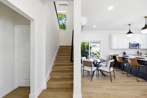 a view of a dining room with furniture window and wooden floor