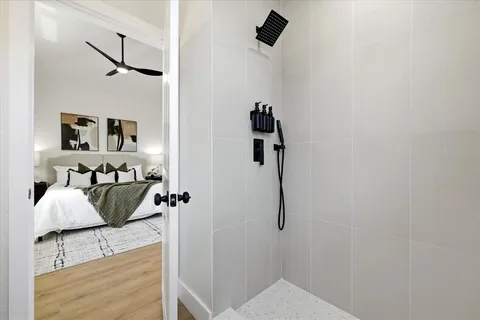 a view of a small space with wooden floor and a window