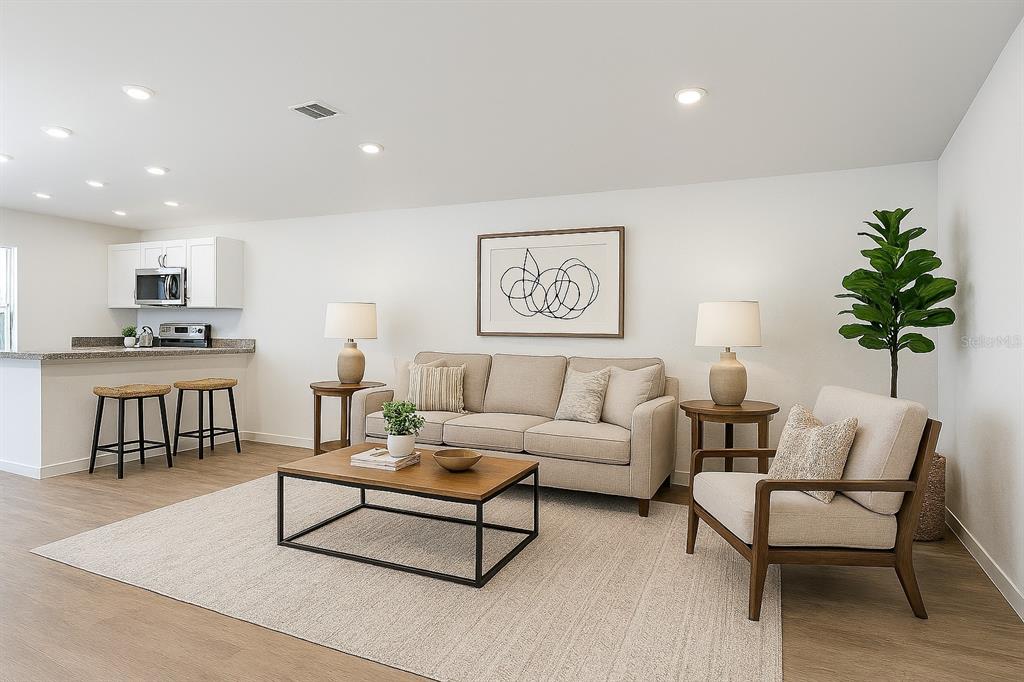 1145 South Apopka Avenue Inverness, FL 34452 - Photo 2 of 13 a living room with furniture and a kitchen view
