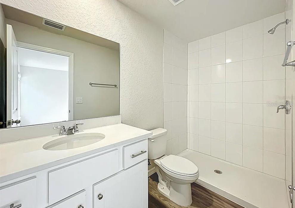1145 South Apopka Avenue Inverness, FL 34452 - Photo 8 of 13 a bathroom with a sink toilet and shower
