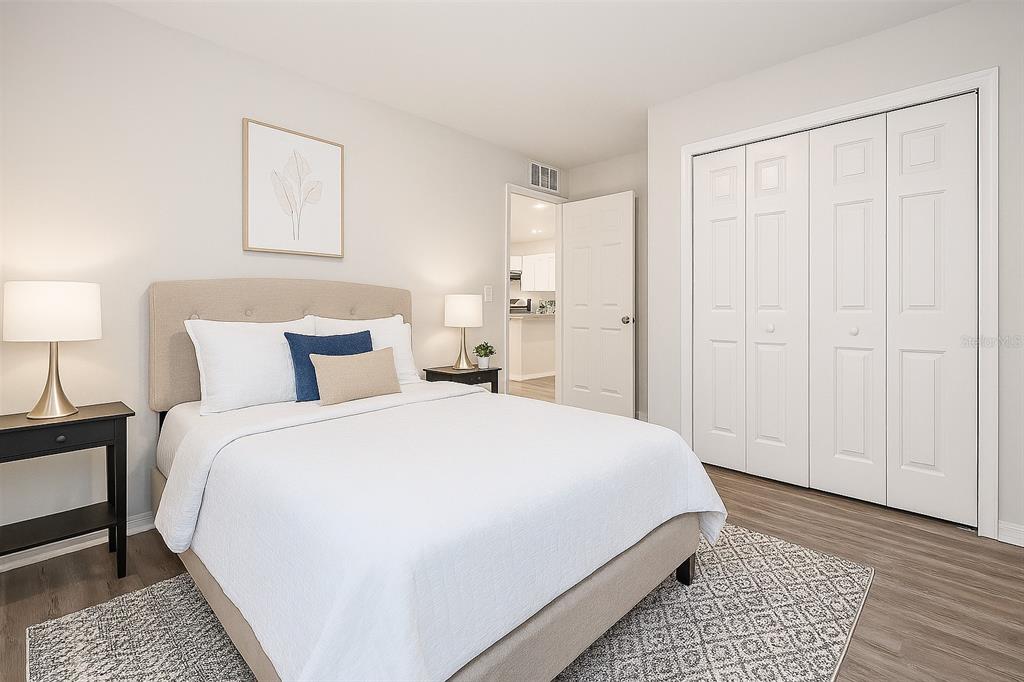 1145 South Apopka Avenue Inverness, FL 34452 - Photo 10 of 13 a bedroom with a bed and a night stand