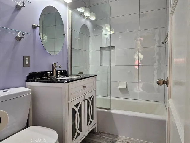a bathroom with a toilet a sink and bathtub