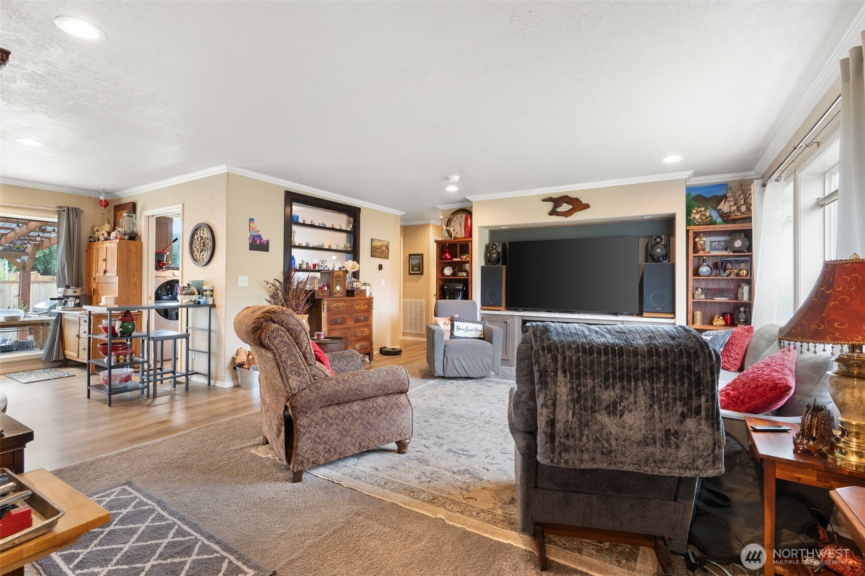 608 Main Street Vader, WA 98593 - Photo 8 of 37 a living room with furniture a flat screen tv and a large window