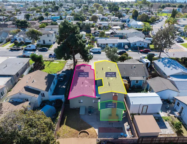 an aerial view of a houses with outdoor space