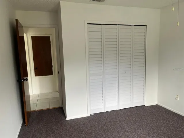 a white toilet and tub sitting next to a bathroom sink