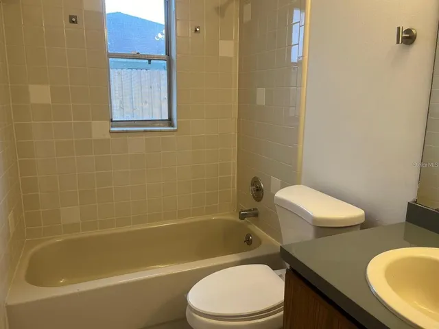 a view of an empty room with a floor to ceiling window