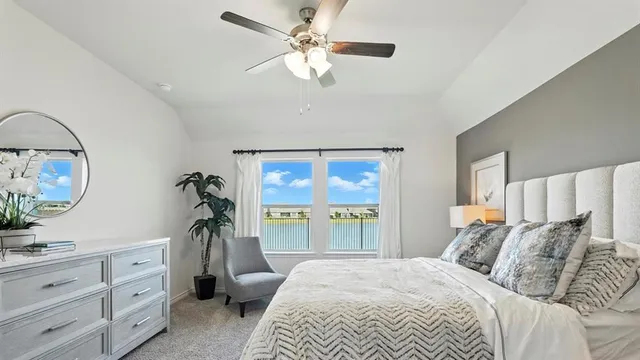 a bedroom with a bed and a lamp