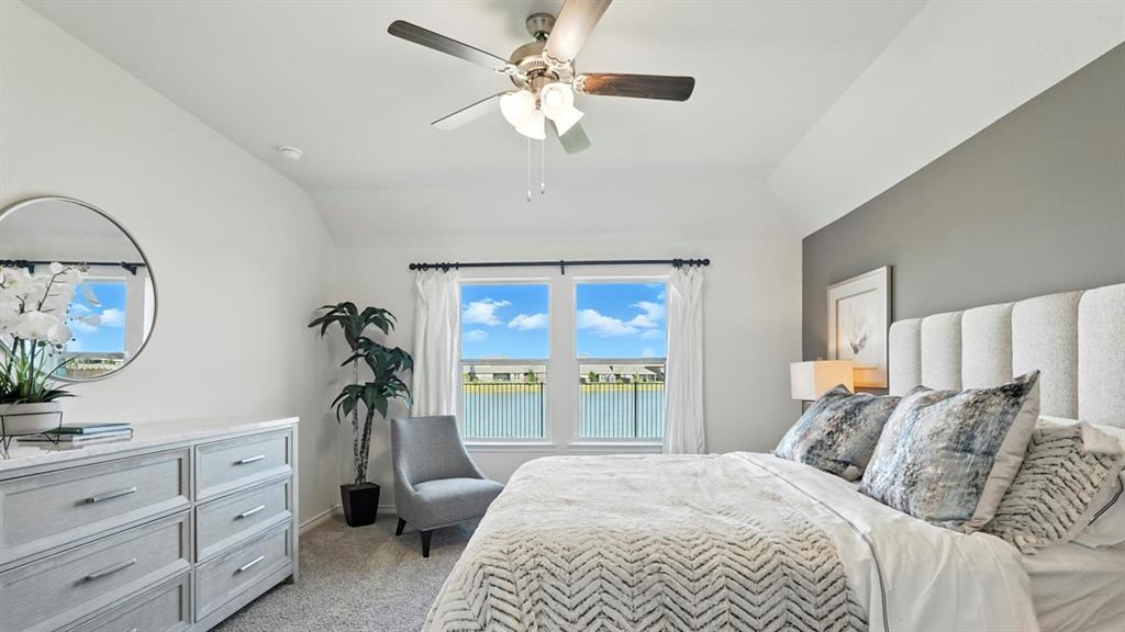 9820 Amalgam Street Aubrey, TX 76227 - Photo 26 of 40 a bedroom with a bed and a dresser