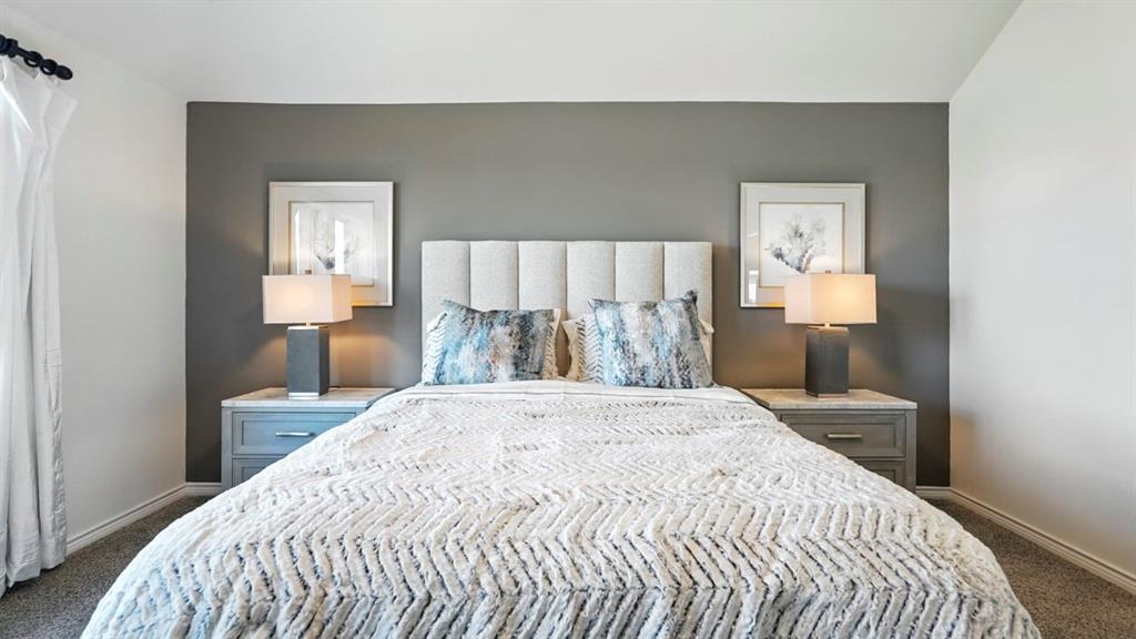 9820 Amalgam Street Aubrey, TX 76227 - Photo 27 of 40 a bedroom with a bed and a lamp