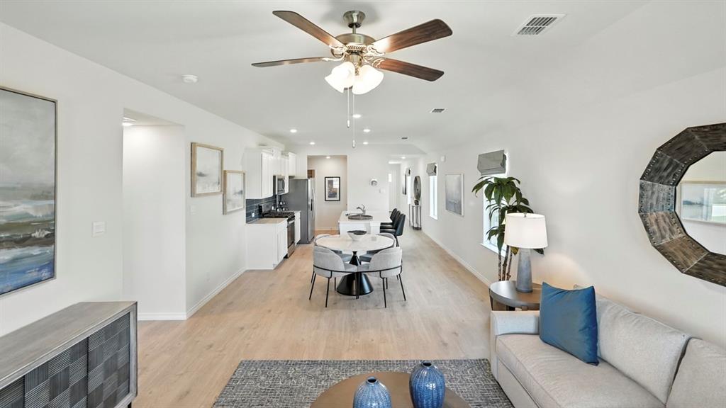 9820 Amalgam Street Aubrey, TX 76227 - Photo 7 of 40 a living room with furniture and kitchen view
