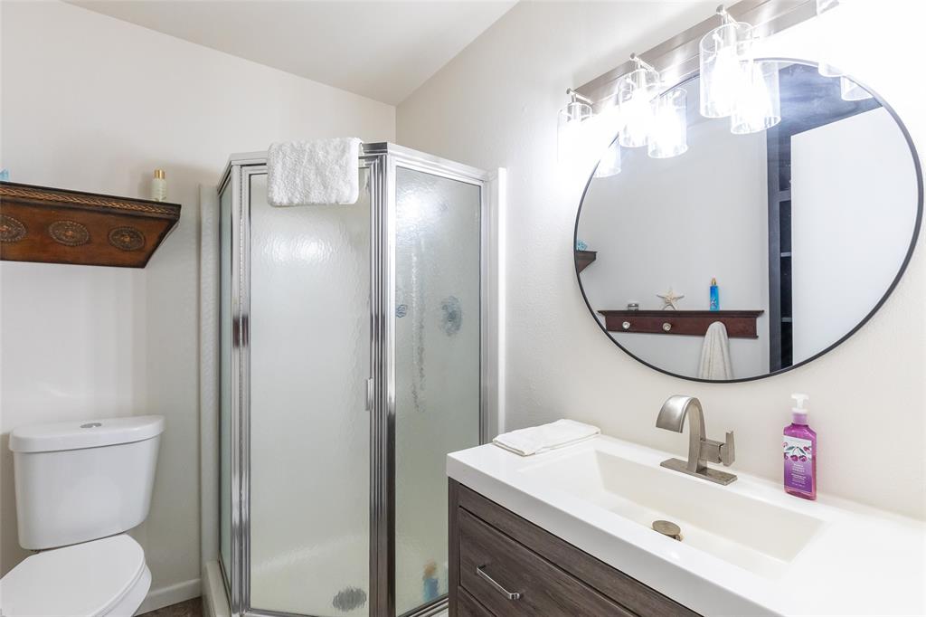 642 Fm 3200 Comanche, TX 76442 - Photo 23 of 37 a bathroom with a sink mirror and toilet