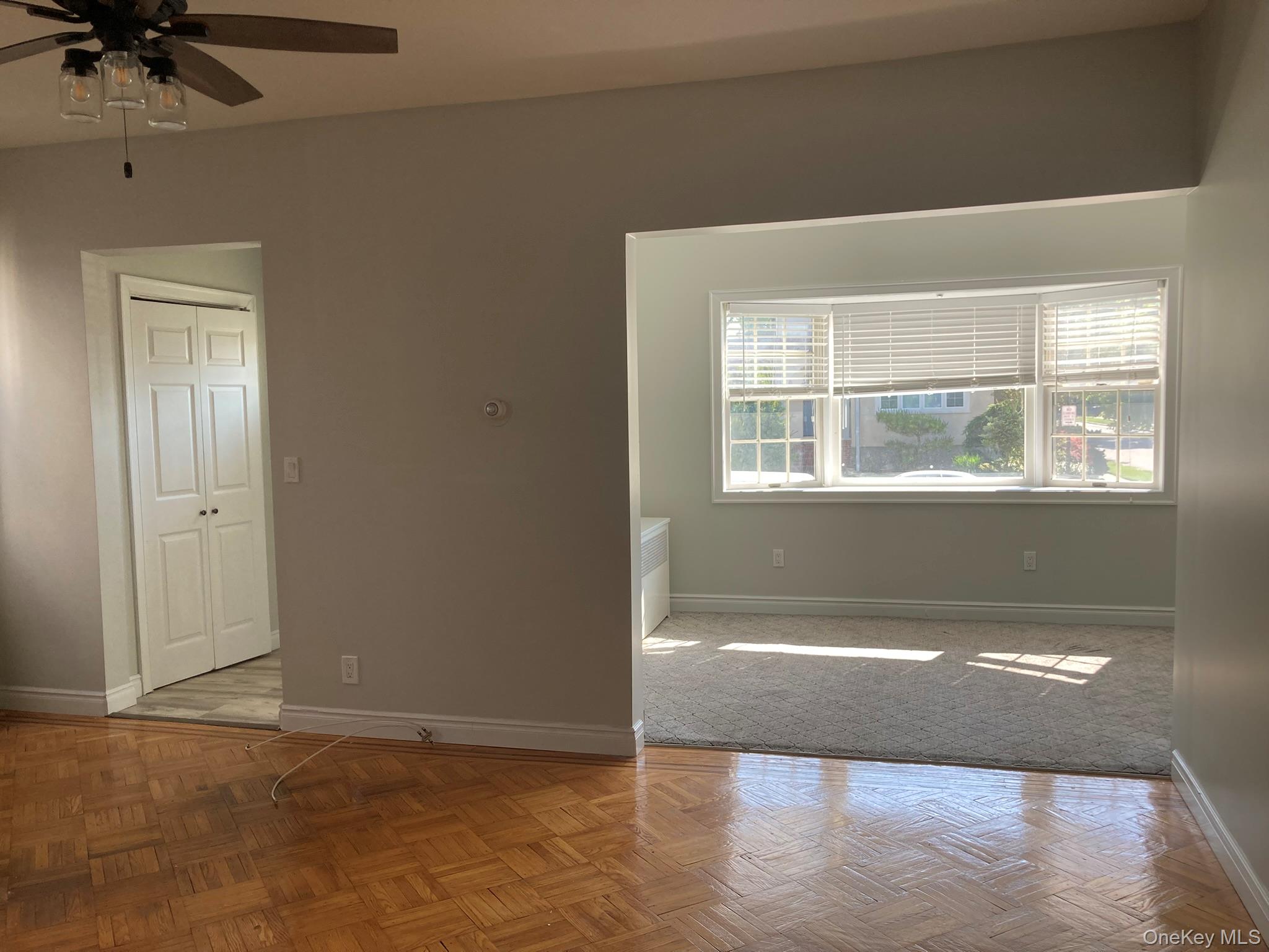 513 Marcellus Road, Unit 1 Williston Park, NY 11596 - Photo 7 of 11 an empty room with a window