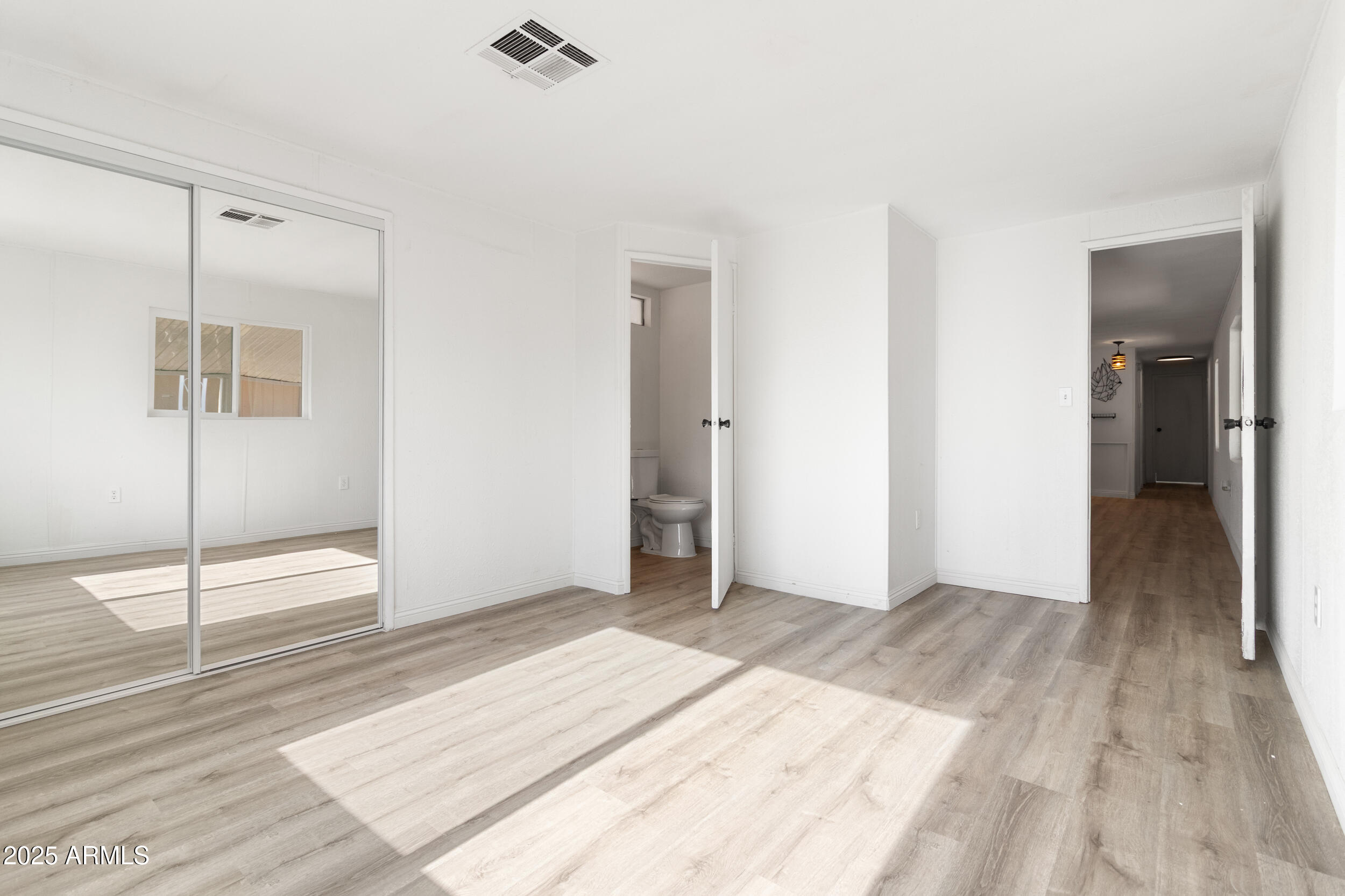 400 West Baseline Road, Unit 100 Tempe, AZ 85283 - Photo 18 of 46 a view of a room with wooden floor