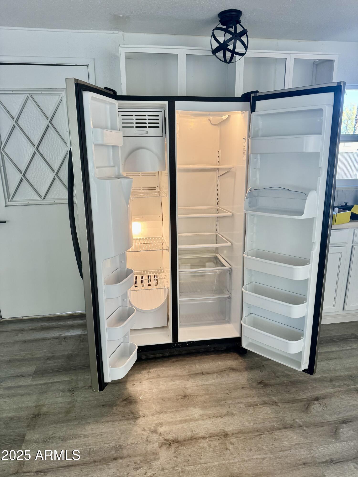 400 West Baseline Road, Unit 100 Tempe, AZ 85283 - Photo 3 of 46 a view of walk in closet with empty racks