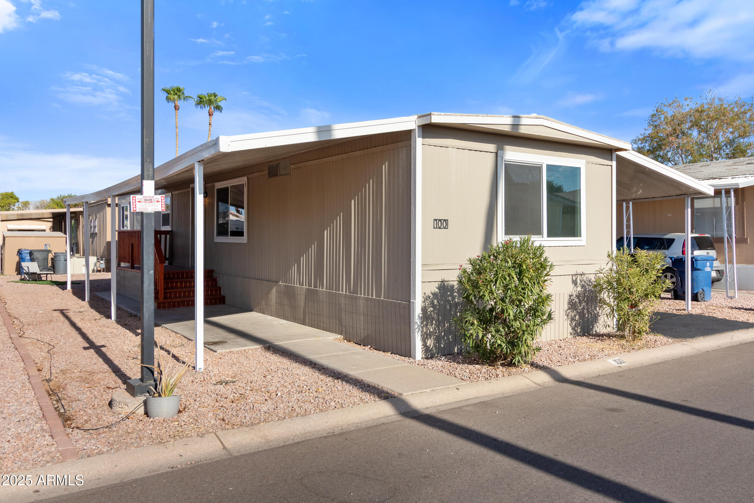 400 West Baseline Road, Unit 100 Tempe, AZ 85283 - Photo 4 of 46 a house with trees in front of it