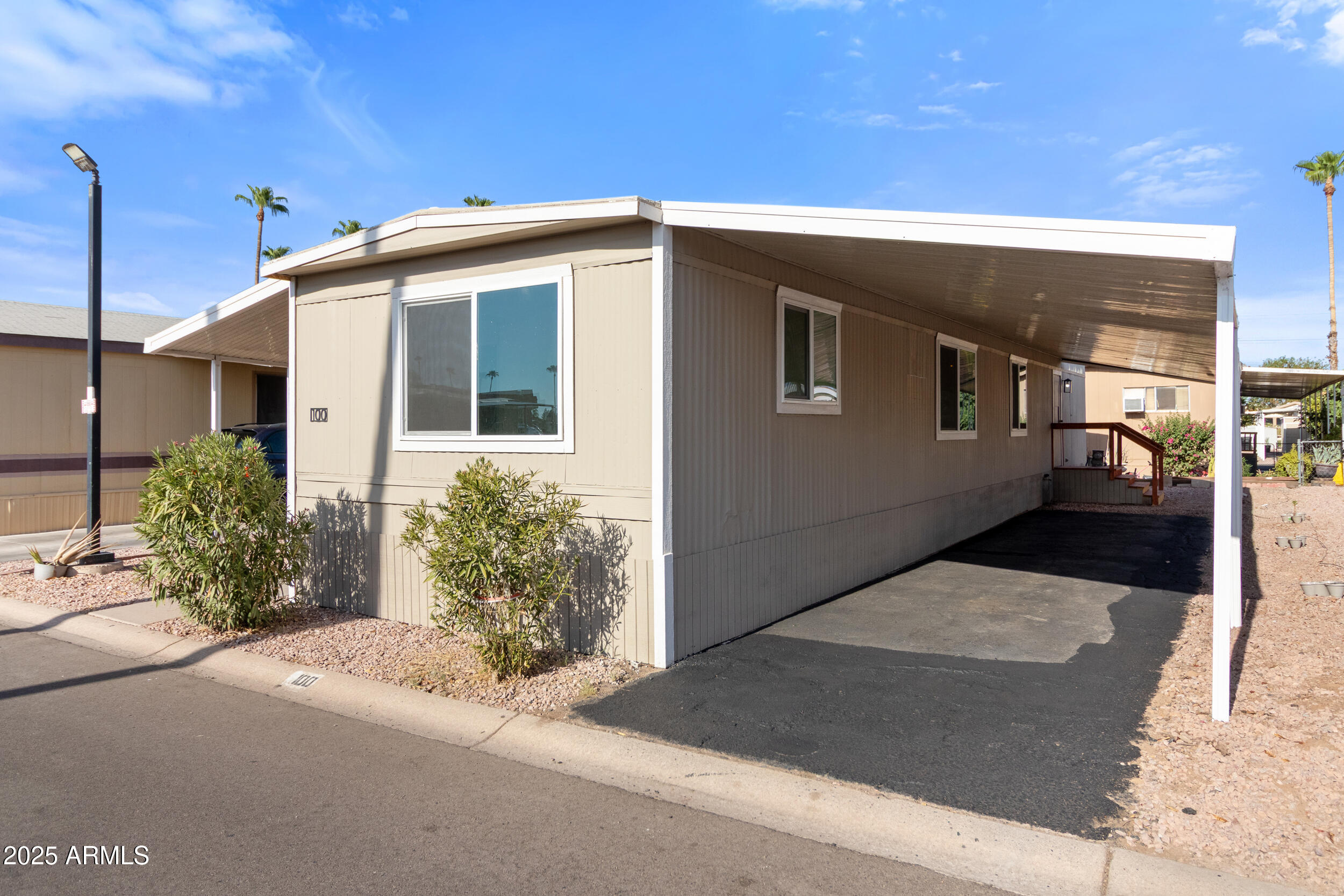 400 West Baseline Road, Unit 100 Tempe, AZ 85283 - Photo 6 of 46 a front view of a house with garden
