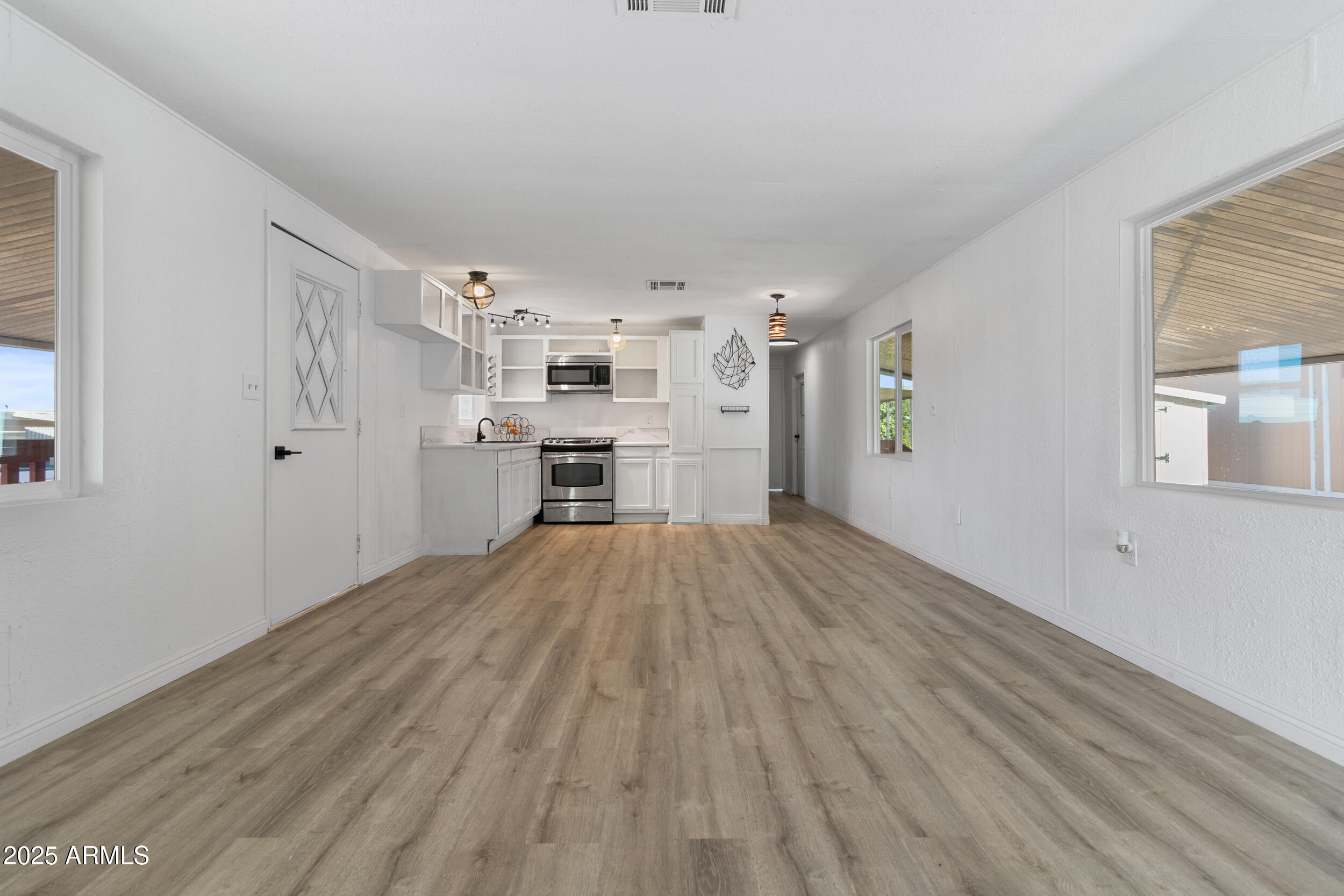 400 West Baseline Road, Unit 100 Tempe, AZ 85283 - Photo 8 of 46 a view of kitchen and wooden floor
