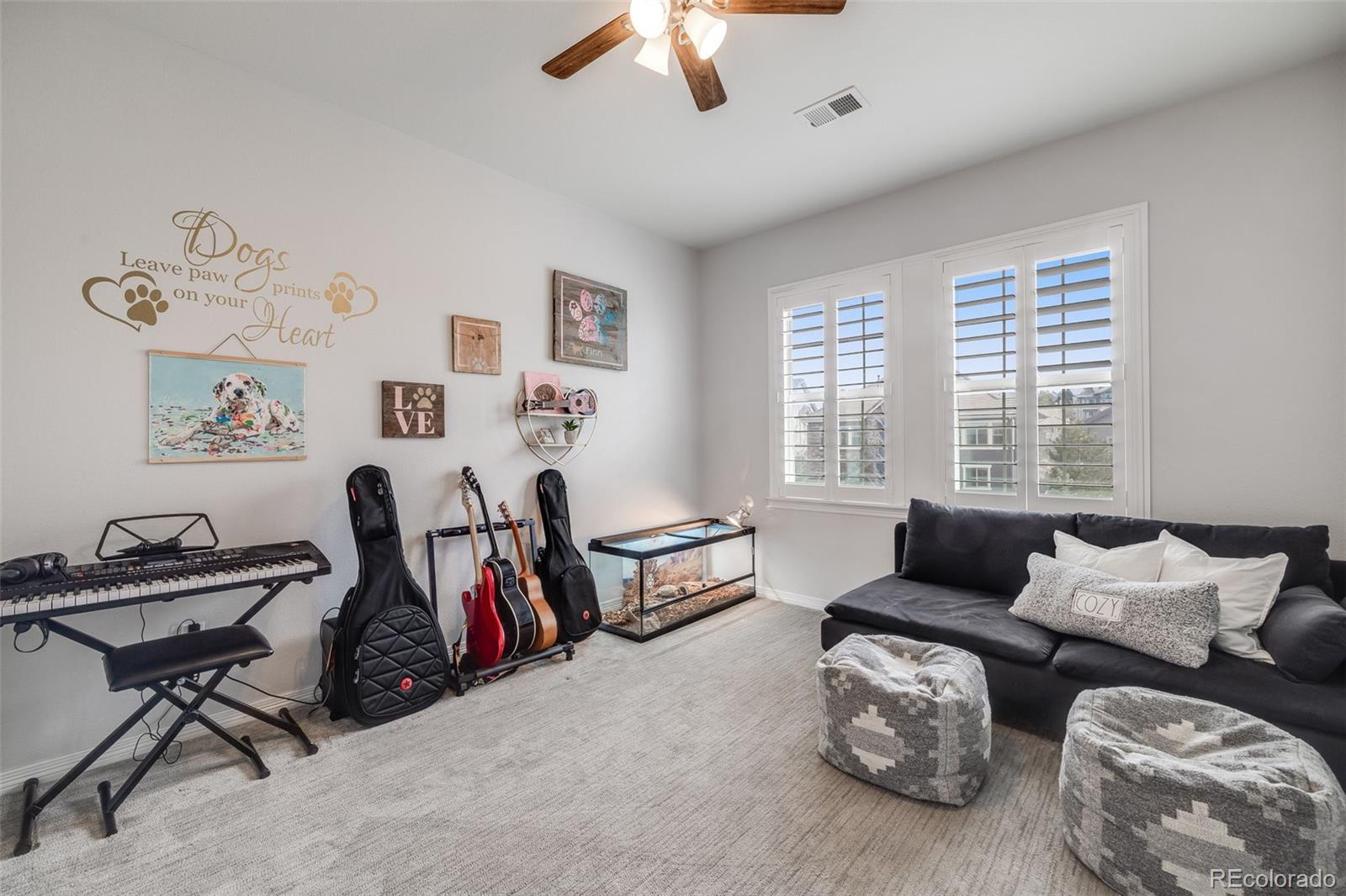 10702 Sundial Rim Road Highlands Ranch, CO 80126 - Photo 26 of 49 a living room with furniture and a window