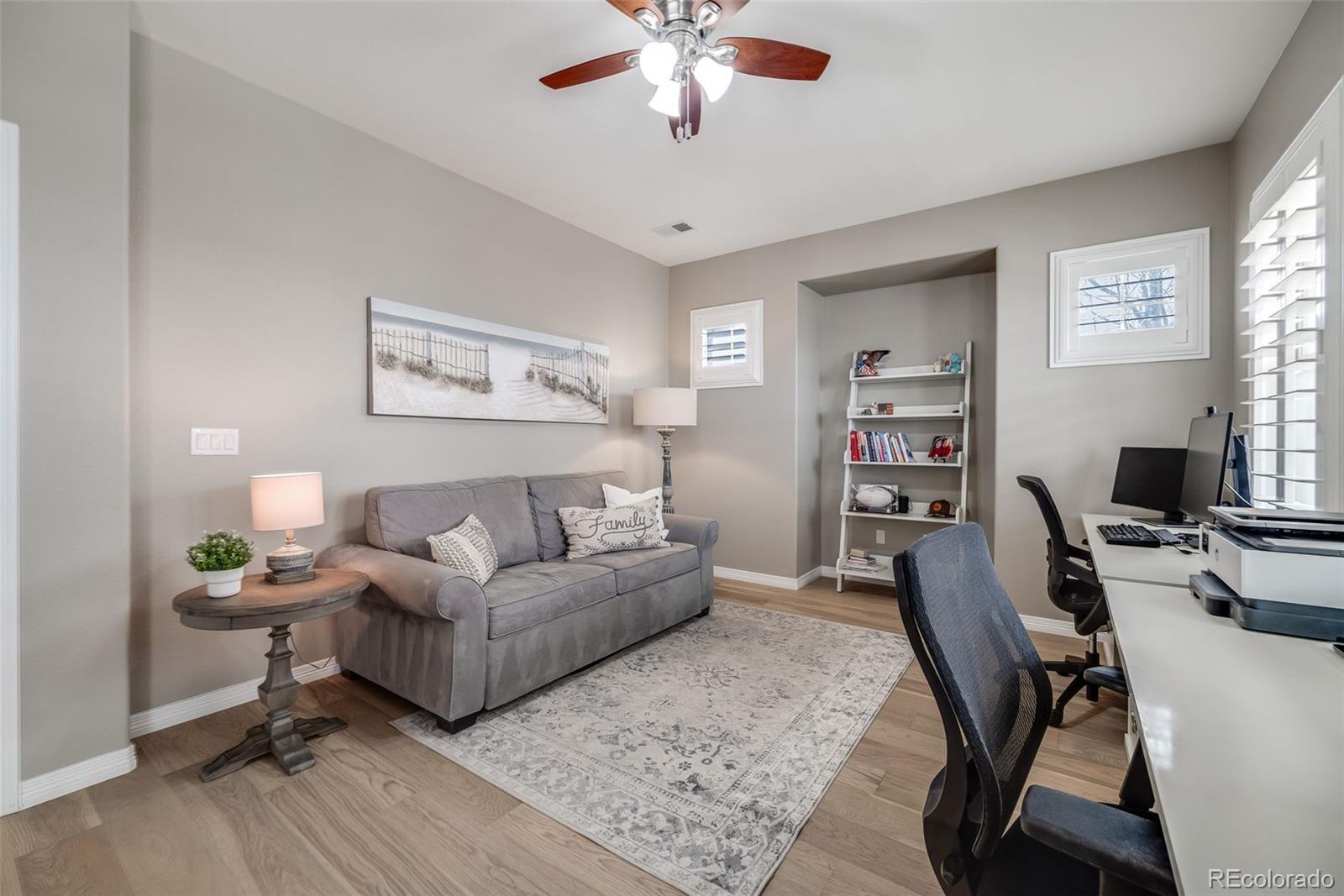10702 Sundial Rim Road Highlands Ranch, CO 80126 - Photo 27 of 49 a living room with furniture and a window
