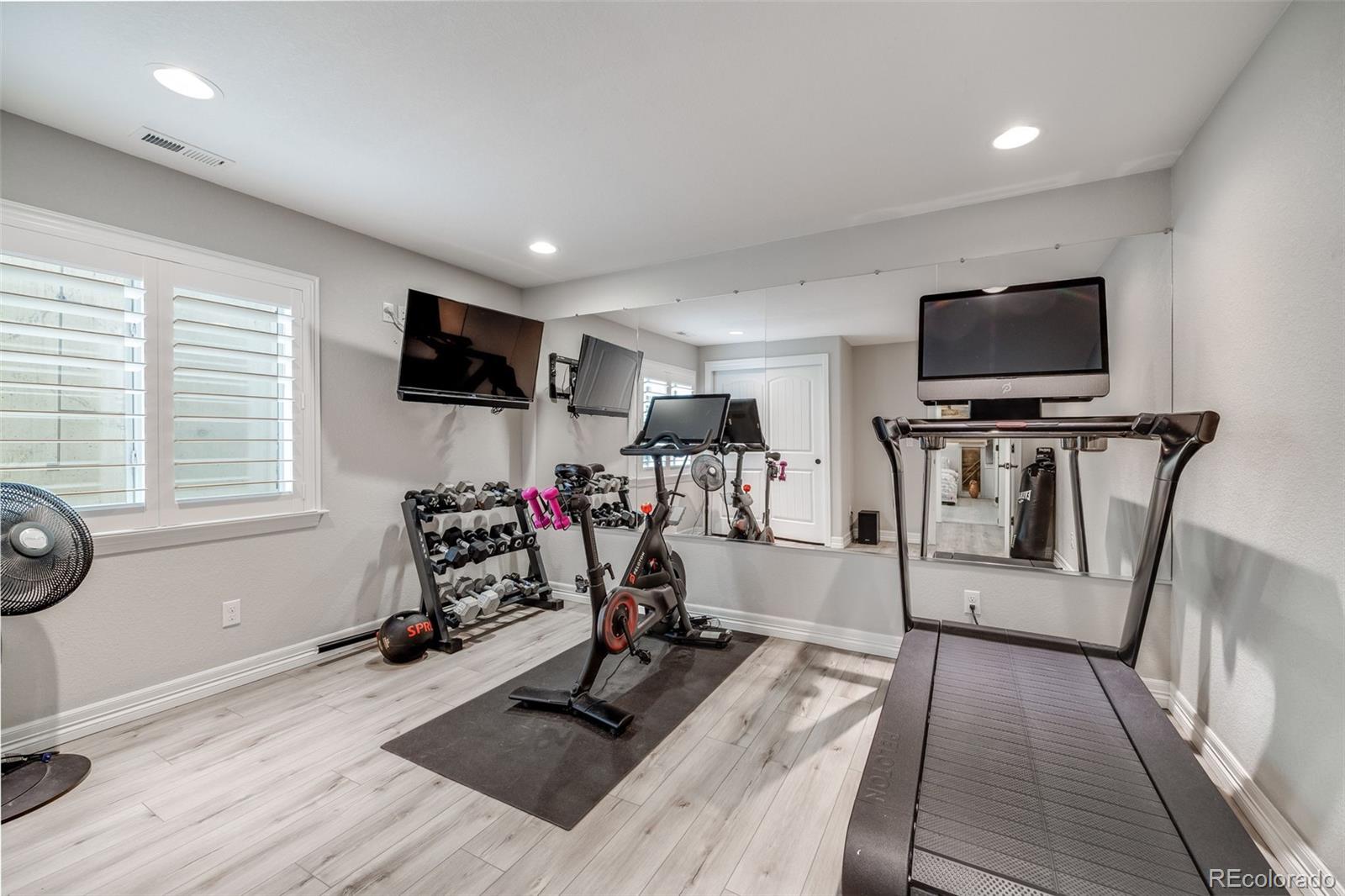 10702 Sundial Rim Road Highlands Ranch, CO 80126 - Photo 34 of 49 a view of a room with gym equipment
