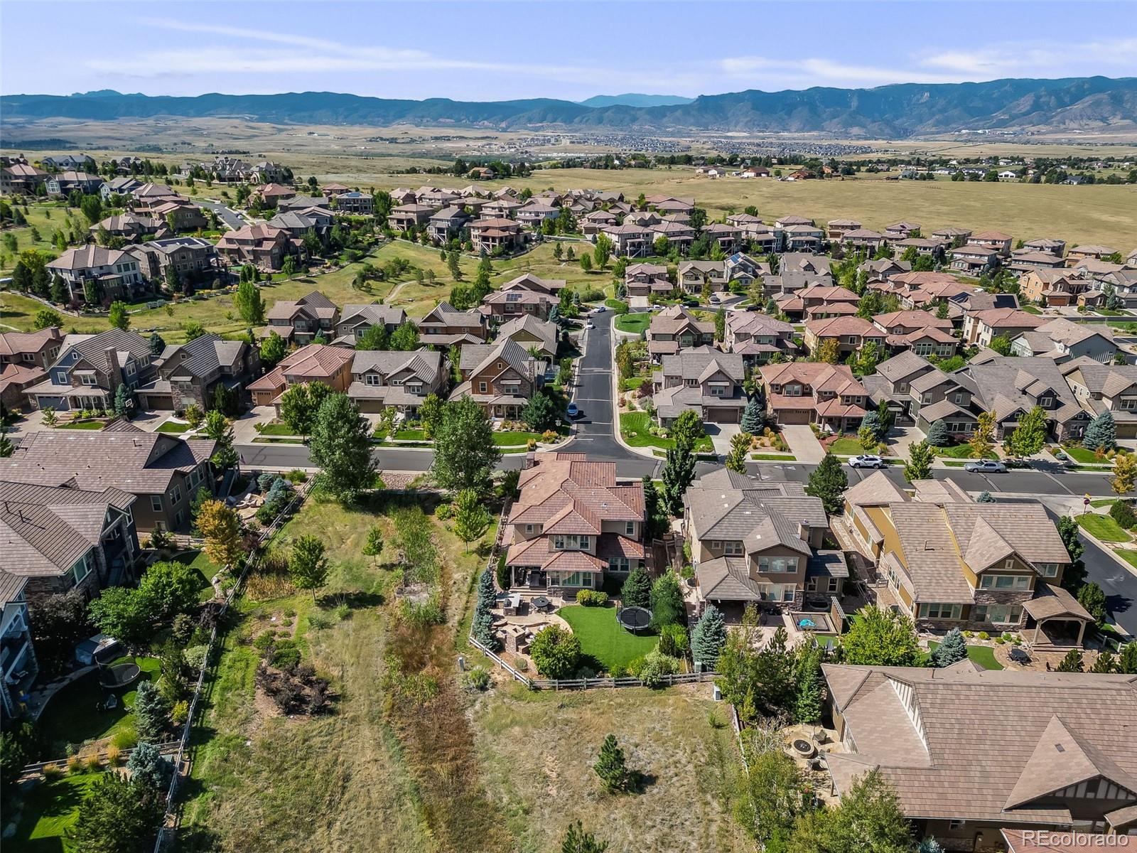 10702 Sundial Rim Road Highlands Ranch, CO 80126 - Photo 45 of 49 a view of a city with mountains