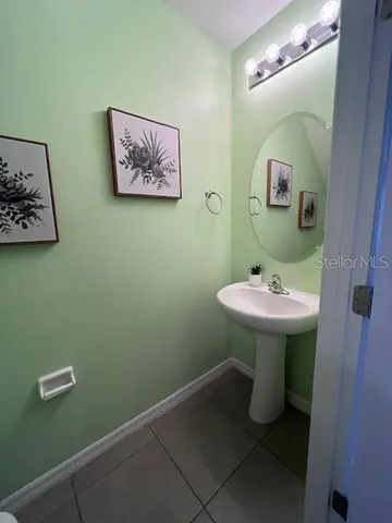 a bathroom with a sink and mirror