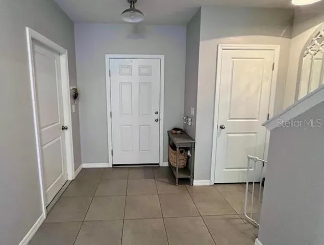 a view of a storage & utility room with closet dryer