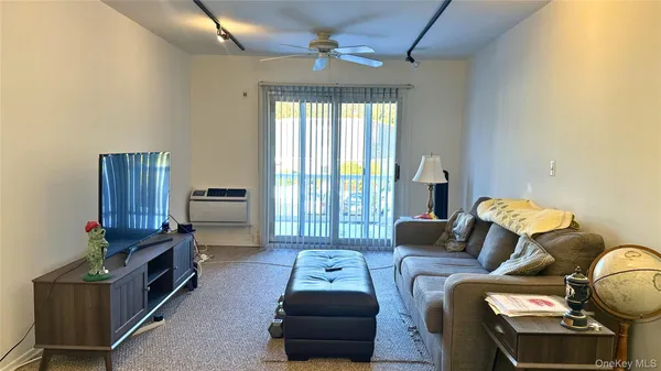 a living room with furniture and a window