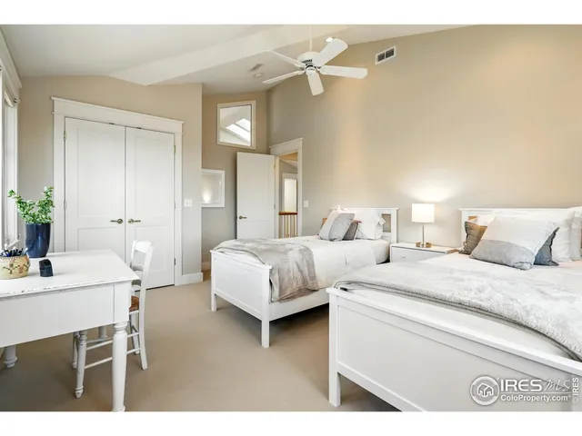 a bedroom with a bed and a table in it